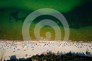 Aerial view of Baltic Sea beach with swimming people in Wladyslawowo, Poland