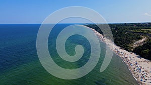 Aerial view of Baltic Sea beach with swimming people in Wladyslawowo, Poland