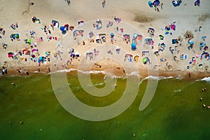 Aerial view of Baltic Sea beach with swimming people in Wladyslawowo, Poland