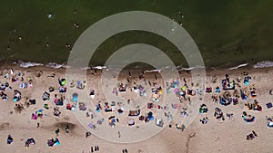 Aerial view of Baltic Sea beach with swimming people in Wladyslawowo, Poland