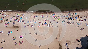 Aerial view of Baltic Sea beach with swimming people in Wladyslawowo, Poland