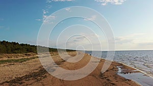 Aerial View of the Baltic Sea Coastline Garciems, Latvia. Empty Beach and Dunes in Summer Evening