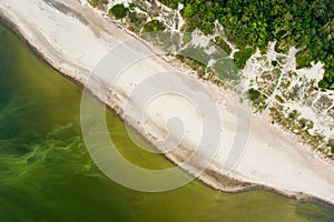 Aerial view of the Baltic Sea shore line near Klaipeda city, Lithuania. Beautiful sea coast on summer day