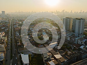 Aerial view of Bangkok downtown, Cars on traffic road and buildings, Thailand.