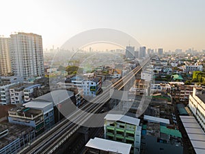 Aerial view of Bangkok downtown, Sky train railway, Cars on traffic road and buildings, Thailand.