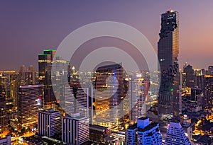 Aerial view of Bangkok modern office buildings, condominium in Bangkok city downtown with sunset sky