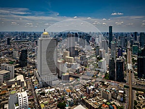 Aerial view of Bangkok skyline and skyscraper with BTS skytrain photo