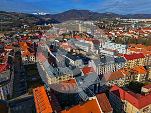 Aerial view of Banska Bystrica city center during winter with Krizna mountain on horizont