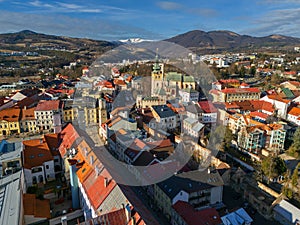 Aerial view of Banska Bystrica city center during winter with Krizna mountain on horizont