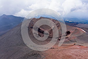 Aerial view of the Barbagallo crater with tourists and hikers on the Etna volcano in Sicily