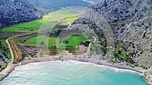 Aerial view of Barboros Beach, Turkey, shows lagoon, tranquility in a mountain valley by blue bay. Lagoon, tranquility