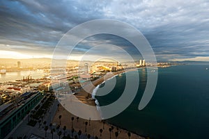 Aerial view of Barcelona Beach during sunset along seaside in Barcelona, Spain. Mediterranean Sea in Spain