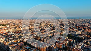 Aerial view of Barcelona city skyline, Gracia and Eixample district at sunset