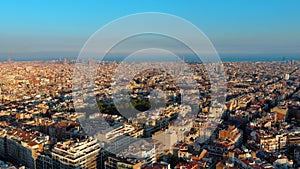 Aerial view of Barcelona city skyline, Gracia and Eixample district at sunset