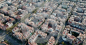 Aerial view of Barcelona cityscape with peculiar geometric grid of Eixample district