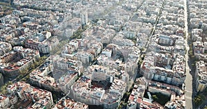 Aerial view of Barcelona cityscape with peculiar geometric grid of Eixample district