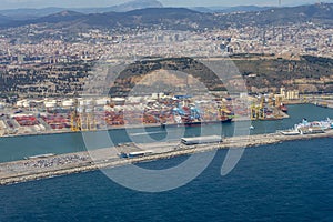 An aerial view of Barcelona\'s seaport, sea and cityscape.