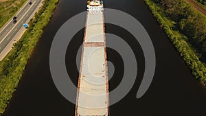 Aerial view:Barge on the river.