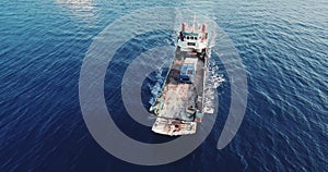 Aerial view of barge transporting single truck