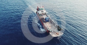 Aerial view of barge transporting single truck