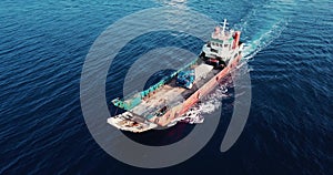 Aerial view of barge transporting single truck