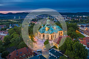 Aerial view of baroque church temple in the heart of Karkonosze mountains in Jelenia Gora surrounded by old city architecture