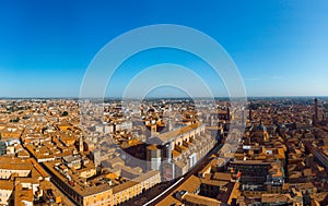 Aerial view of Basilica di San Petronio, Bologna, Italy at sunset. Colorful sky over the historical city center with car traffic