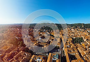 Aerial view of Basilica of San Domenico, Bologna, Italy at sunset. Colorful sky over the historical city center with car traffic