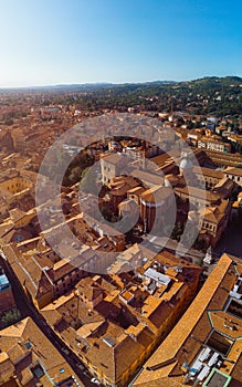 Aerial view of Basilica of San Domenico, Bologna, Italy at sunset. Colorful sky over the historical city center with car traffic