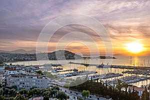 Aerial view of bay of kusadasi port parked with yachts and boats at sunset