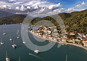 Aerial view of a bay with sailing boats at sunset