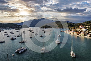 Aerial view of a bay with sailing boats at sunset