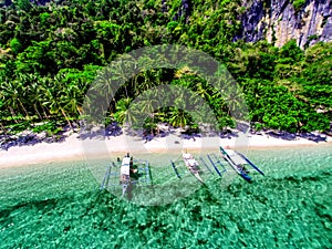 Aerial view of the beach with fishing boats. Elnido, Philippines, 2018