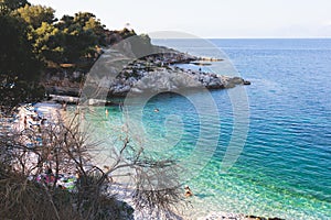 Aerial view of beach in Kassiopi village in northeast coast of Corfu island, Ionian Islands, Kerkyra, Greece in a summer sunny day