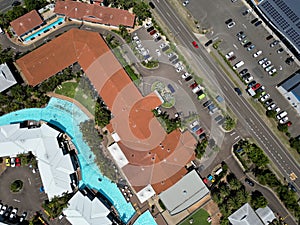 Aerial view of a beach resort with swimming pool and multiple buildings