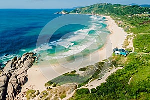 Aerial view of beach with rocks and ocean. Mole beach in Florianopolis