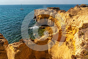 Aerial view of beach surrounded by cliffs at beach Coelha
