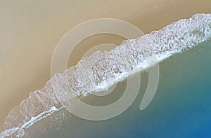 Aerial view with beach in wave of turquoise sea water shot, Top view