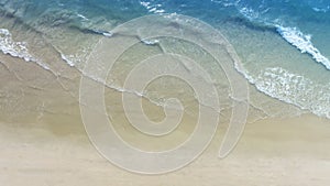 Aerial view with beach in wave of turquoise sea water shot, Top view