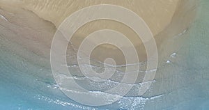 Aerial view with beach in wave of turquoise sea water shot, Top view