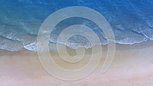 Aerial view with beach in wave of turquoise sea water shot, Top view of beautiful white sand