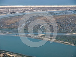 Aerial view of the beautiful Algarve coast, Parque natural Ria Formosa, in Portugal seen on a flight to Faro