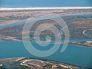 Aerial view of the beautiful Algarve coast, Parque natural Ria Formosa, in Portugal seen on a flight to Faro