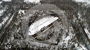 Aerial view of beautiful ancient fortress in forest in winter. Tarakaniv Fort.