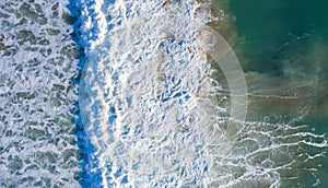 Aerial view of beautiful Atlantic waves breaking in south Spain