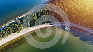 Aerial view on beautiful bay at sunny day with sandy beach and boats.