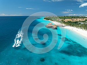 Aerial view of beautiful bungalow and sea at sunset in summer photo