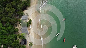 aerial view of beautiful caribbean beach in the Venezuela coast. Drone shot of white sand and pristine tropical landscape with