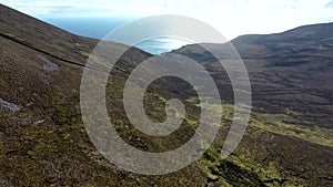 Aerial view of the beautiful coast at Malin Beg with Slieve League in the background in County Donegal, Ireland