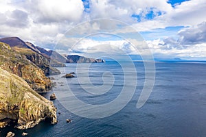 Aerial view of the beautiful coast at Malin Beg with Slieve League in the background in County Donegal, Ireland